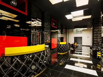 a bar with yellow and black chairs in a room at Ramada Hotel & Suites Sisli in Istanbul