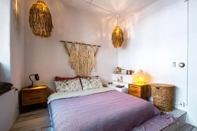 a bedroom with a bed and two night stands at Boheme House with Bathtub & Terrace in Istanbul