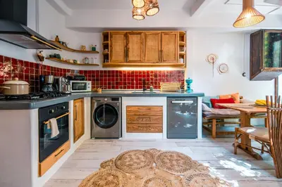 a kitchen with a washer and dryer at Boheme House with Bathtub & Terrace in Istanbul