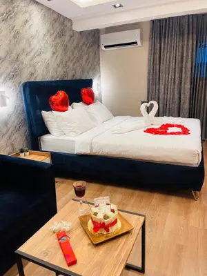 a hotel room with a bed and a coffee table at Taksim REXXEE Istanbul Istiklal Hotel in Istanbul