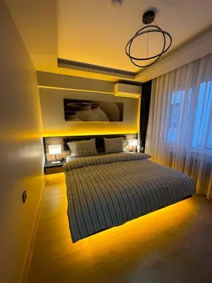 a bedroom with a bed with a light on it at Tomtom HOUSE Centre Location in Istanbul