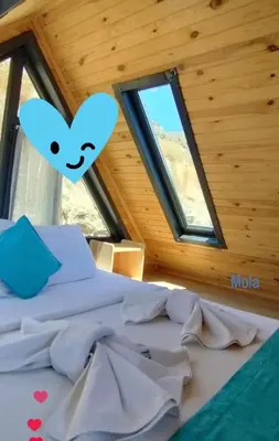 a bedroom with a bed with a heart on it at MOLA villas&suites in Marmara