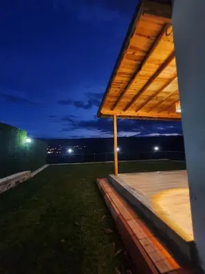 a night view of a patio with a roof at Eviniz rahatlığında, eşsiz doğa manzaralı dağ evi in Gölcük