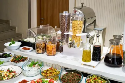 a buffet with many dishes of food on a table at Thank You Hotel Sultanahmet in Istanbul