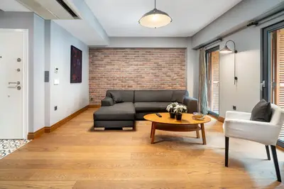 a living room with a couch and a table at Urban Quarters - Asmalı Mescit in Istanbul