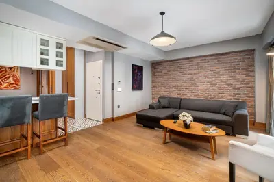 a living room with a couch and a table at Urban Quarters - Asmalı Mescit in Istanbul