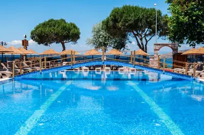 a bridge over a pool at a resort at Avsa Artemis Hotel in Avsa Adasi