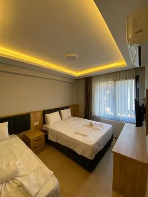 a hotel room with two beds in a room at dolphin hotel cafe in Istanbul