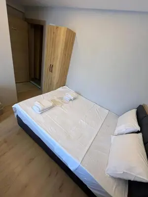 a bed with two towels on it in a room at dolphin hotel cafe in Istanbul