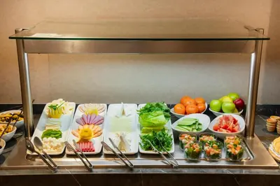 a buffet with different types of vegetables in bowls at Riva Hotel Nişantaşı in Istanbul