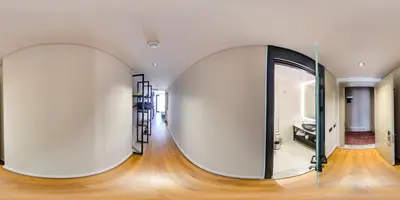 a room with two large white walls and a mirror at Theodosius Hotel in Istanbul