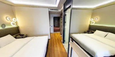 a small room with two beds in it at Theodosius Hotel in Istanbul
