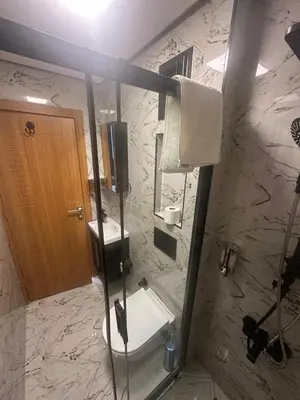 a bathroom with a sink and a toilet and a mirror at Elita Otel Kumkapı in Istanbul