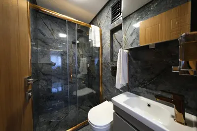 a bathroom with a shower and a toilet and a sink at Elita Otel Kumkapı in Istanbul