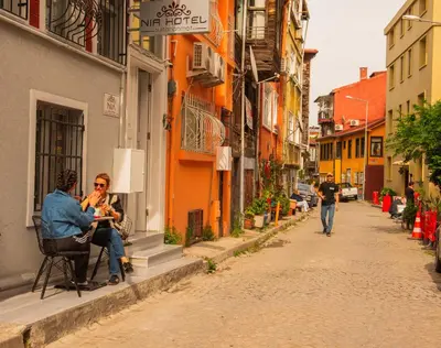 a couple of people sitting on a chair on a street at NİA SULTANAHMET in Istanbul