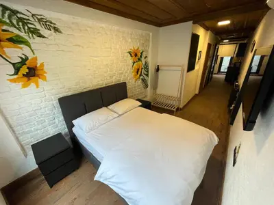 a bedroom with a white bed and a brick wall at Casa Mirasol Terrace Golden Horn Istanbul in Istanbul