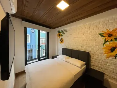 a bedroom with a bed and a brick wall at Casa Mirasol Terrace Golden Horn Istanbul in Istanbul
