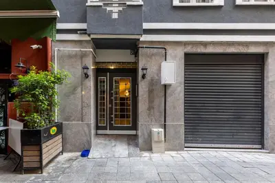 a building with a garage door and a gate at Sedef Apartments Pera in Istanbul