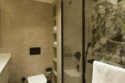 a bathroom with a shower with a glass door at G Residences Gayrettepe in Istanbul