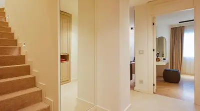 a hallway with a staircase in a house at G Residences Gayrettepe in Istanbul