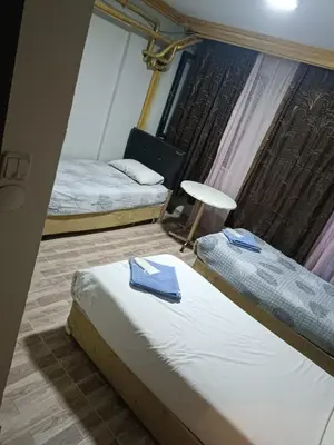 a hotel room with two beds and a window at Suite Hotel in Istanbul