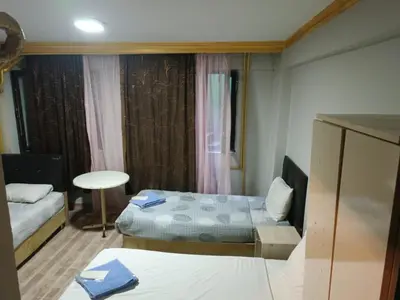 a small room with two beds and a table at Suite Hotel in Istanbul