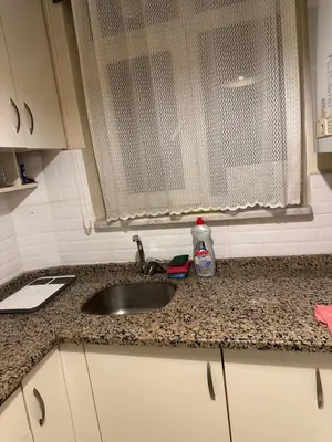 a kitchen counter with a sink and a window at Sea view House in Istanbul