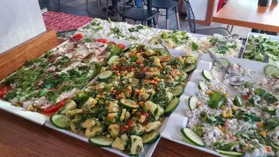 a buffet of different types of food on a table at Sirkeci Esen Apart in Istanbul