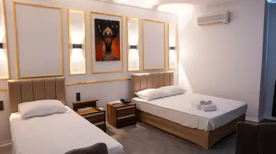 two beds in a small room with at Global Termal Hotel in Çekirge
