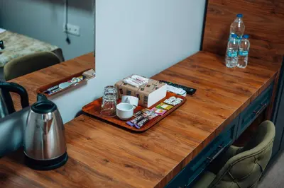a wooden table with a coffee maker on it at Mysia Olympos Hotel in Bursa