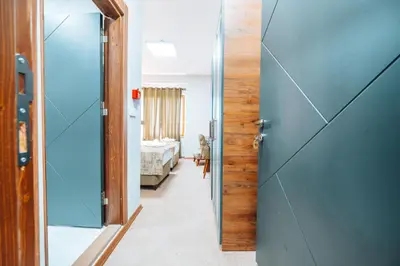 a hallway with a door leading to a bedroom at Mysia Olympos Hotel in Bursa