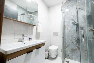 a bathroom with a sink and a shower at Mysia Olympos Hotel in Bursa