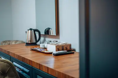 a counter with a box and remote controls on it at Mysia Olympos Hotel in Bursa