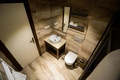 an overhead view of a bathroom with a sink and a toilet at Sea Garden Otel in Darıca