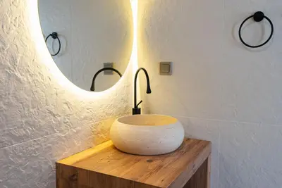 a bathroom with a sink and a mirror at Tare Houses in Istanbul
