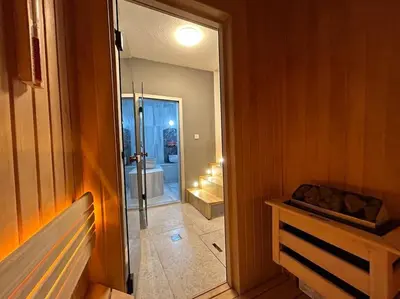 a bathroom with a walk in shower and a mirror at Villa Arancia Istanbul - Garden, BBQ, Sauna & Turkish Bath by the Tram in Fatih in Istanbul