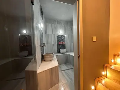 a bathroom with a tub and two toilets in a room at Villa Arancia Istanbul - Garden, BBQ, Sauna & Turkish Bath by the Tram in Fatih in Istanbul