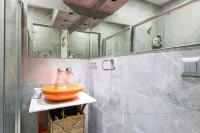 a bathroom with an orange sink on a counter at Stylish Duplex House with a Special Terrace in Istanbul