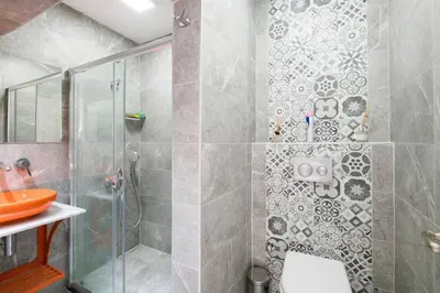 a bathroom with a shower with a toilet and a sink at Cute 1 Room w AC 300 meters to Istiklal Street in Istanbul
