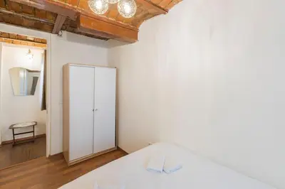 a bedroom with a bed and a white cabinet at Beautiful 1 Br Apt. w/AC 400 meters Taksim Square in Istanbul