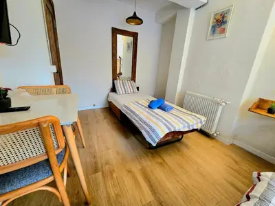 a small room with a bed and a table at Armel Homes Galata in Istanbul