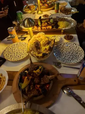 a table with plates of food on a table at Hatay Hotel in Istanbul
