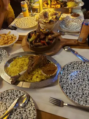 a table with plates of food on a table at Hatay Hotel in Istanbul