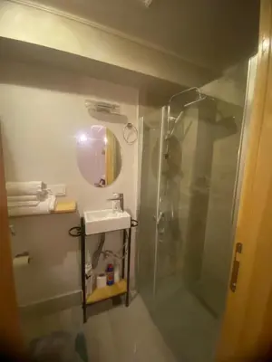 a bathroom with a shower and a sink at Balat Tarihin içinden Pink Home 1 in Istanbul