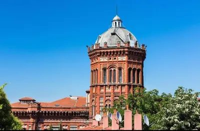 a building with a clock tower on top of it at Balat Tarihin içinden Pink Home 1 in Istanbul