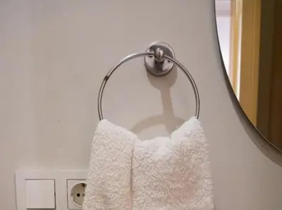 a towel hanging in front of a mirror at Balat Tarih dokulu Pink Home 2 in Istanbul