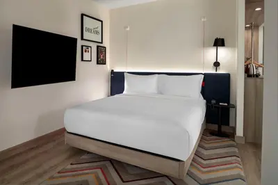 a bedroom with a large white bed in a room at Hampton By Hilton Istanbul Merter in Istanbul