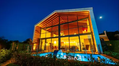 a large glass building with a pool in front of it at Trio Palazio Sapanca in Sapanca