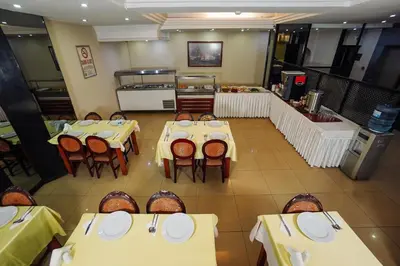 an overhead view of a restaurant with yellow tables and chairs at Topkapi Golden Time Hotel in Istanbul