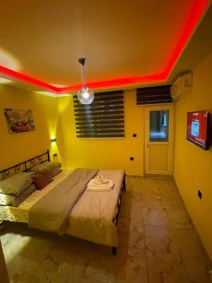 a bedroom with a bed with a red ceiling at Taksim academie house in Istanbul